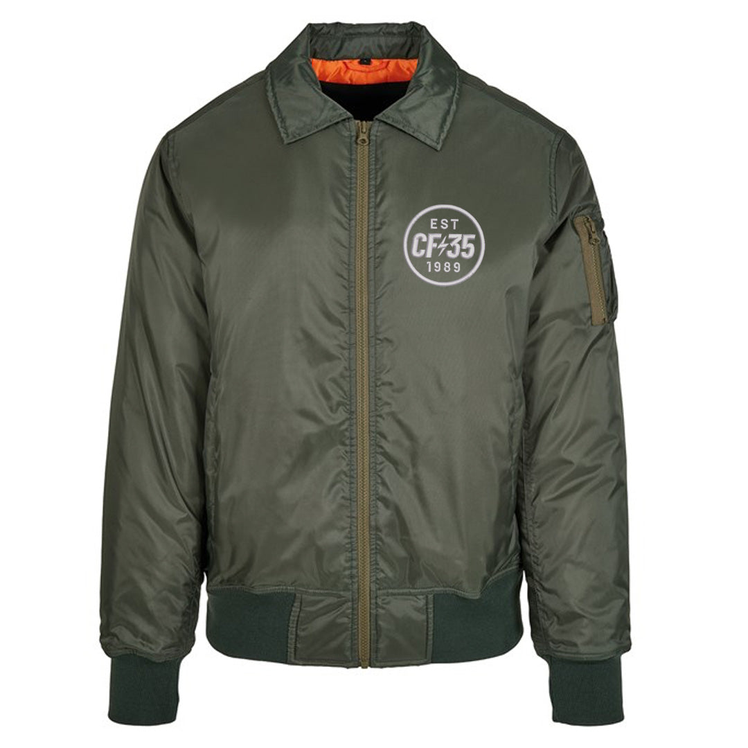 CF35 green bomber jacket with white embroidered CF35 logo on left and contrast orange lining.