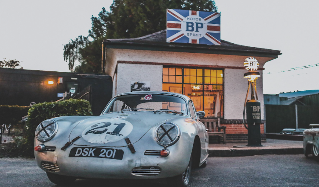 Cool Flo Porsche 356 by the original fuelling station.
