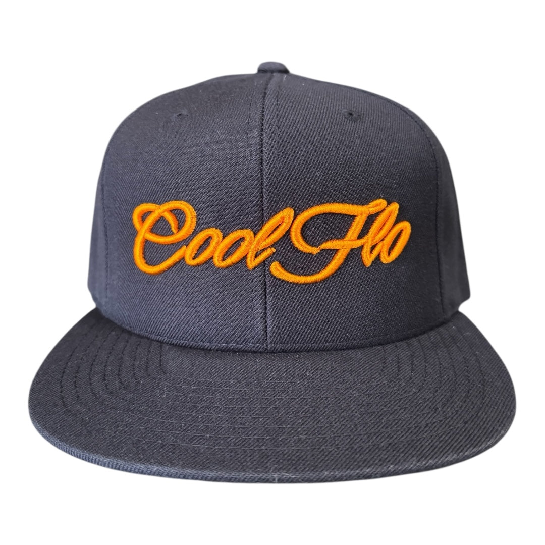 Navy snapback cap with bold orange 3D embroidered Cool Flo script logo on the front.