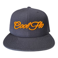 Navy snapback cap with bold orange 3D embroidered Cool Flo script logo on the front.