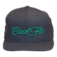 Front view of a Cool Flo snapback cap in Dark Grey featuring a raised 3D Green embroidered Script logo and flat visor