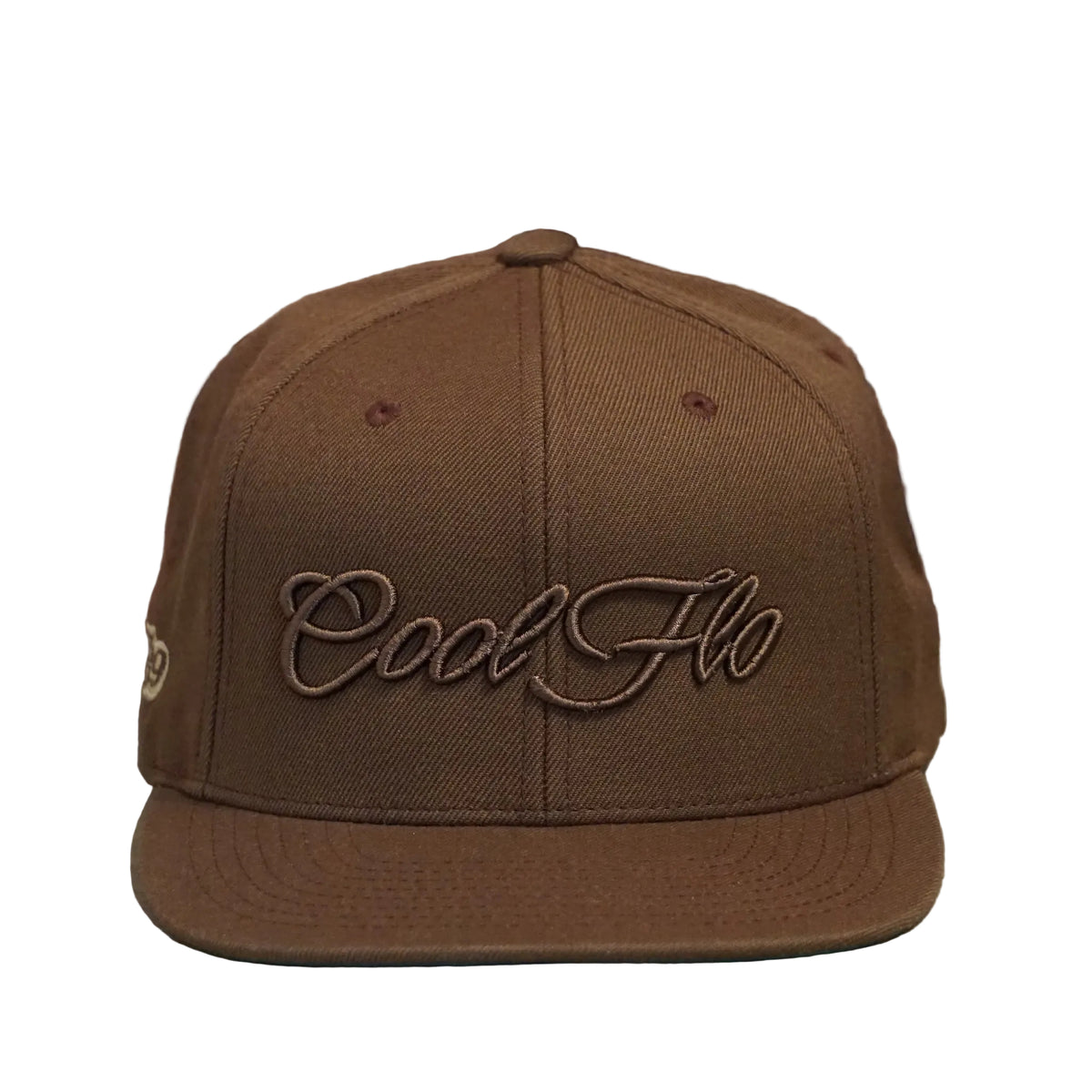 Front view of a Cool Flo Tan snapback cap featuring a matching raised 3D embroidered Script logo and flat visor
