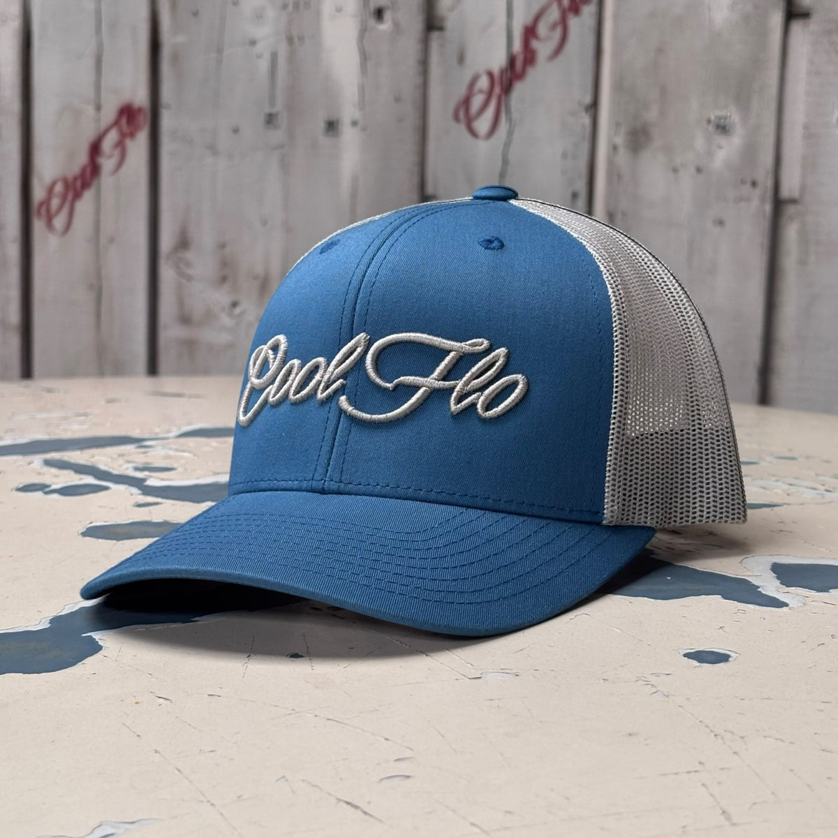 Cool Flo Blue/Silver trucker cap with raised 3D embroidered Script logo, curved visor and mesh back panels - front