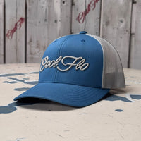 Cool Flo Blue/Silver trucker cap with raised 3D embroidered Script logo, curved visor and mesh back panels - front