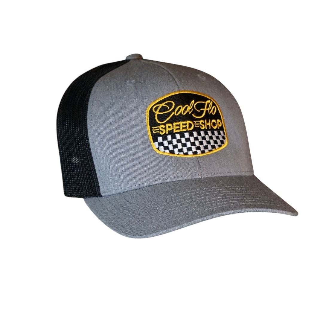 Cool Flo grey and black trucker cap with  logo and Speed Shop chequered design in yellow, black and white embroidery.