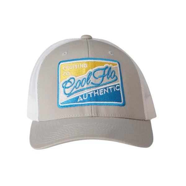 Cool Flo Authentic Cruising Co - Trucker cap with silver/grey front and white mesh a with a yellow, white, silver and turquoise embroidered badge design