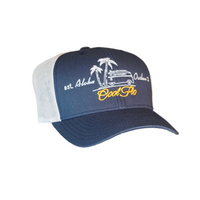 Aloha Outlaw two-tone navy and silver/grey trucker cap with embroidered VW bus and palm tree design.