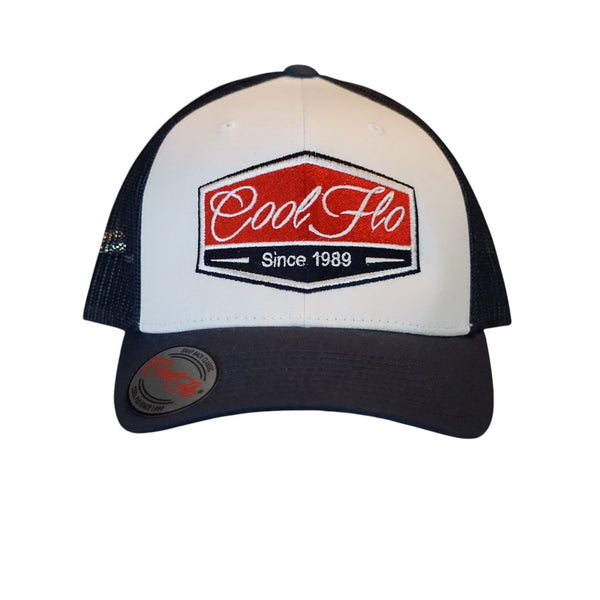 Cool Flo Navy Blue and white contrast trucker cap with navy, red and white embroidered badge design on the front.Cool Flo - Since 1989