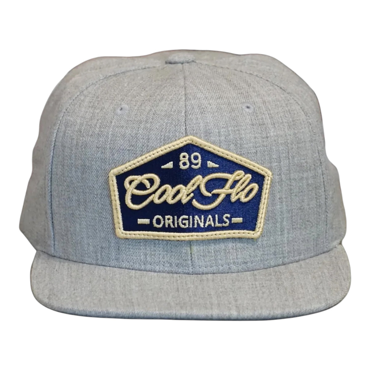 Front view of a Cool Flo 89 Originals snapback cap in Heather Grey featuring an embroidered 89 Originals badge in Navy, Gold and White and a flat visor