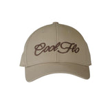 Khaki baseball cap with a 12cm brown script logo embroidered on the front of the cap.