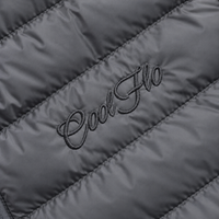 Close-up of tonal Cool Flo Script embroidery on an anthracite quilted jacket.