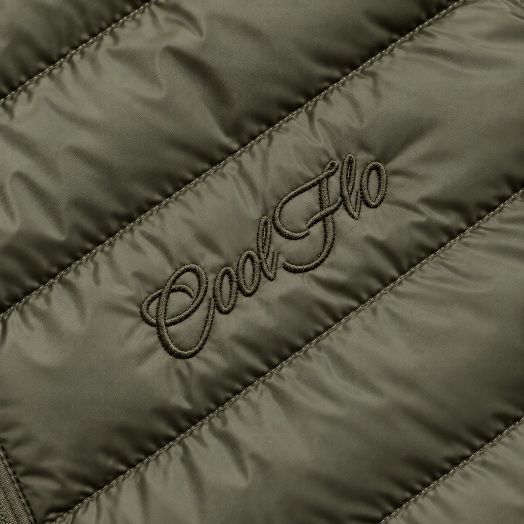 Close-up of tonal Cool Flo Script embroidery on a khaki quilted jacket.