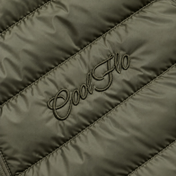 Close-up of tonal Cool Flo Script embroidery on a khaki quilted jacket.