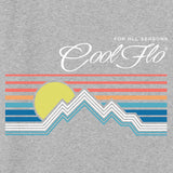 Close-up of Cool Flo heather grey sweatshirt with a graphic design featuring a mountain sunset depicted by lines. For all seasons.