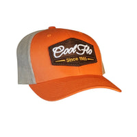 Cool Flo orange and khaki trucker cap with brown, white and orange 3D puff embroidered badge sewn onto the front.