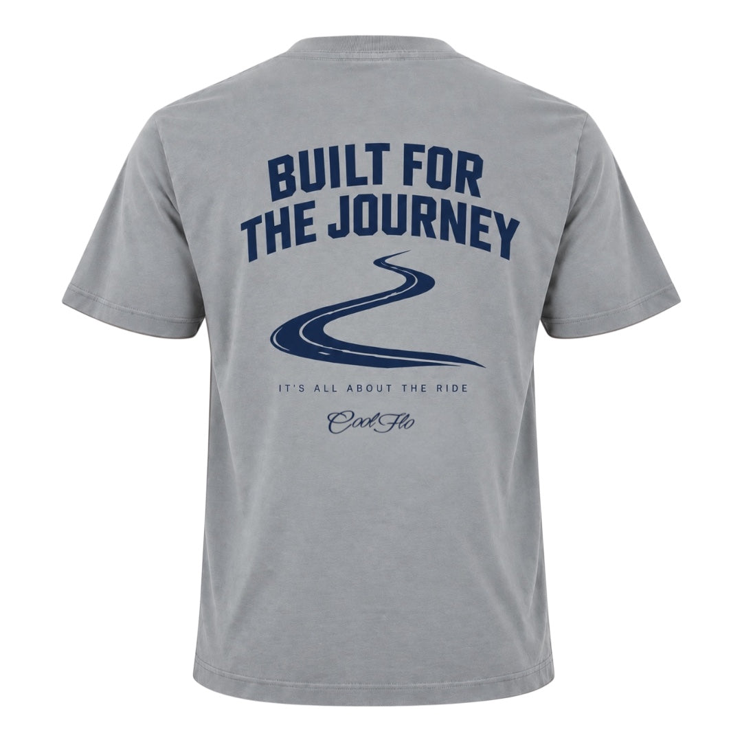 Back view of Cool Flo grey t-shirt, featuring a navy graphic print with the text 'BUILT FOR THE JOURNEY', a winding road illustration, followed by 'IT'S ALL ABOUT THE RIDE' strapline and a Cool Flo script logo.