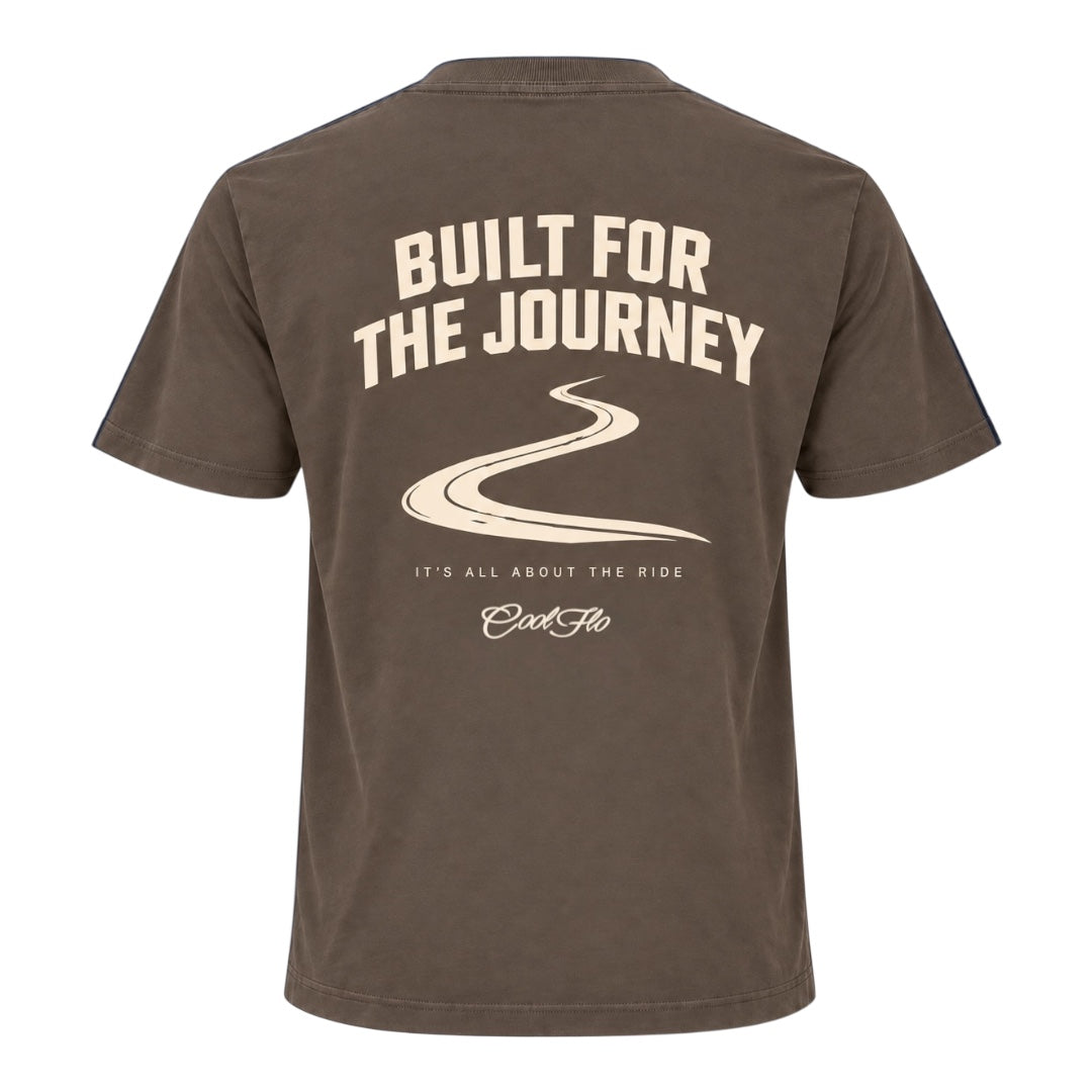 Back view of Cool Flo mocha t-shirt, featuring a cream graphic print with the text 'BUILT FOR THE JOURNEY', a winding road illustration, followed by 'IT'S ALL ABOUT THE RIDE' strapline and a Cool Flo script logo.