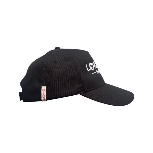Black baseball cap with embroidered white 'Love Dove Generation' on the front_side view