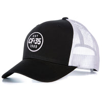 CF35 black and white trucker cap with embroided CF35 anniversary logo 