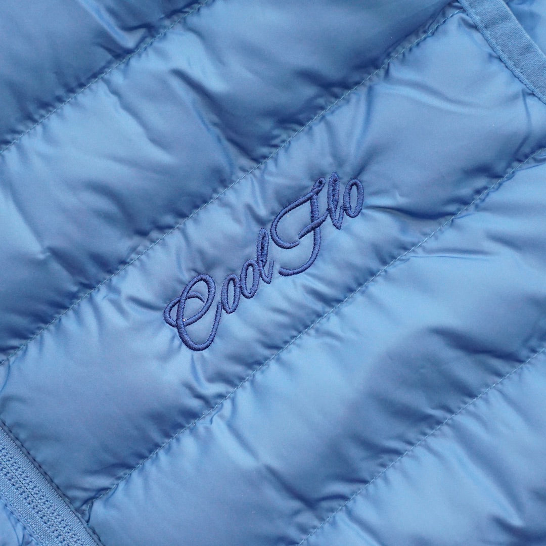 Close-up of blue gilet with matching Cool Flo script logo embroidered on the left.