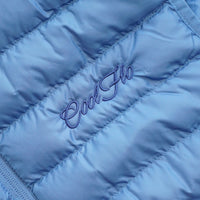 Close-up of blue gilet with matching Cool Flo script logo embroidered on the left.