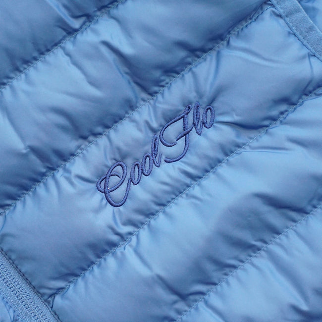 Close-up of blue gilet with matching Cool Flo script logo embroidered on the left.