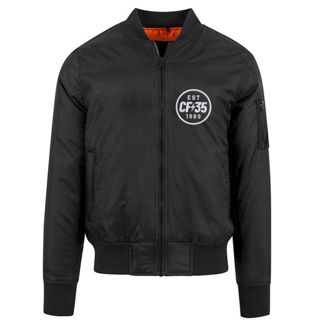 CF35 Classic black bomber with white CF35 logo embroidered on left and contrast orange lining.