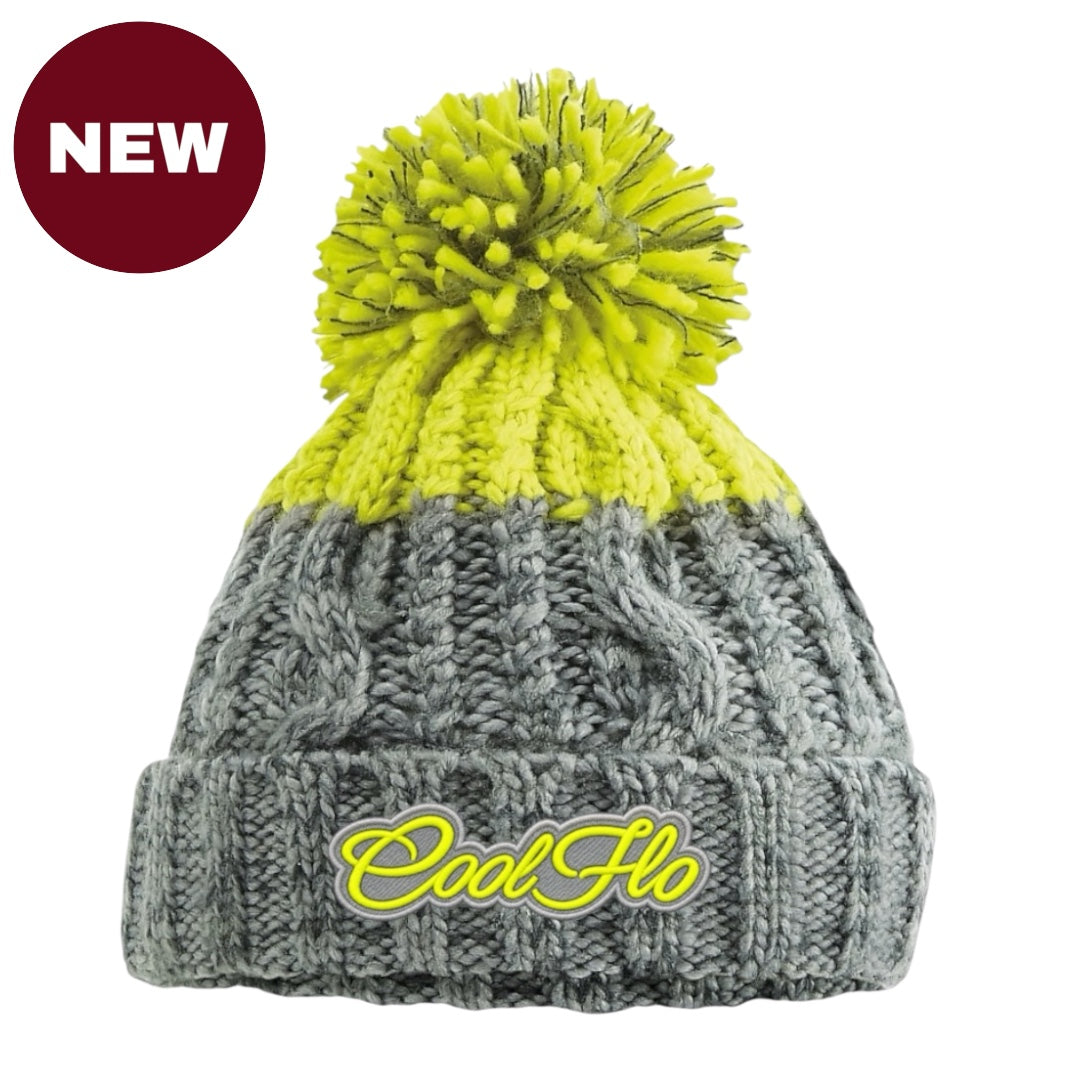 A gray and neon green knit beanie hat with a matching neon yellow pom-pom. The wordmark 'CoolFlo' is embroidered in neon yellow on the front cuff.