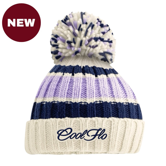 A cream, lilac and navy knit pom-pom beanie with a navy embroidered 'CoolFlo' logo on the front cuff, shown on a white background with a red 'NEW' badge in the top-left corner.