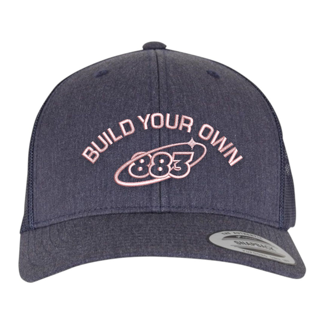 Centreforce 883 custom trucker in heather blue, with pink 'build your own' embroidery and 883 Orbit logo - front view