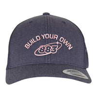 Centreforce 883 custom trucker in heather blue, with pink 'build your own' embroidery and 883 Orbit logo - front view