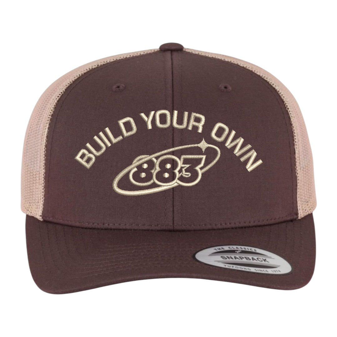 Centreforce 883 custom brown and khaki two-tone trucker in khaki, with khaki 'build your own' embroidery and 883 Orbit logo - front view