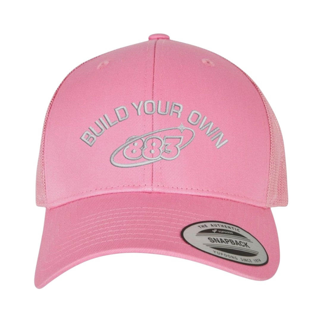 Centreforce 883 custom trucker in pink, with grey 'build your own' embroidery and 883 Orbit logo - front view.
