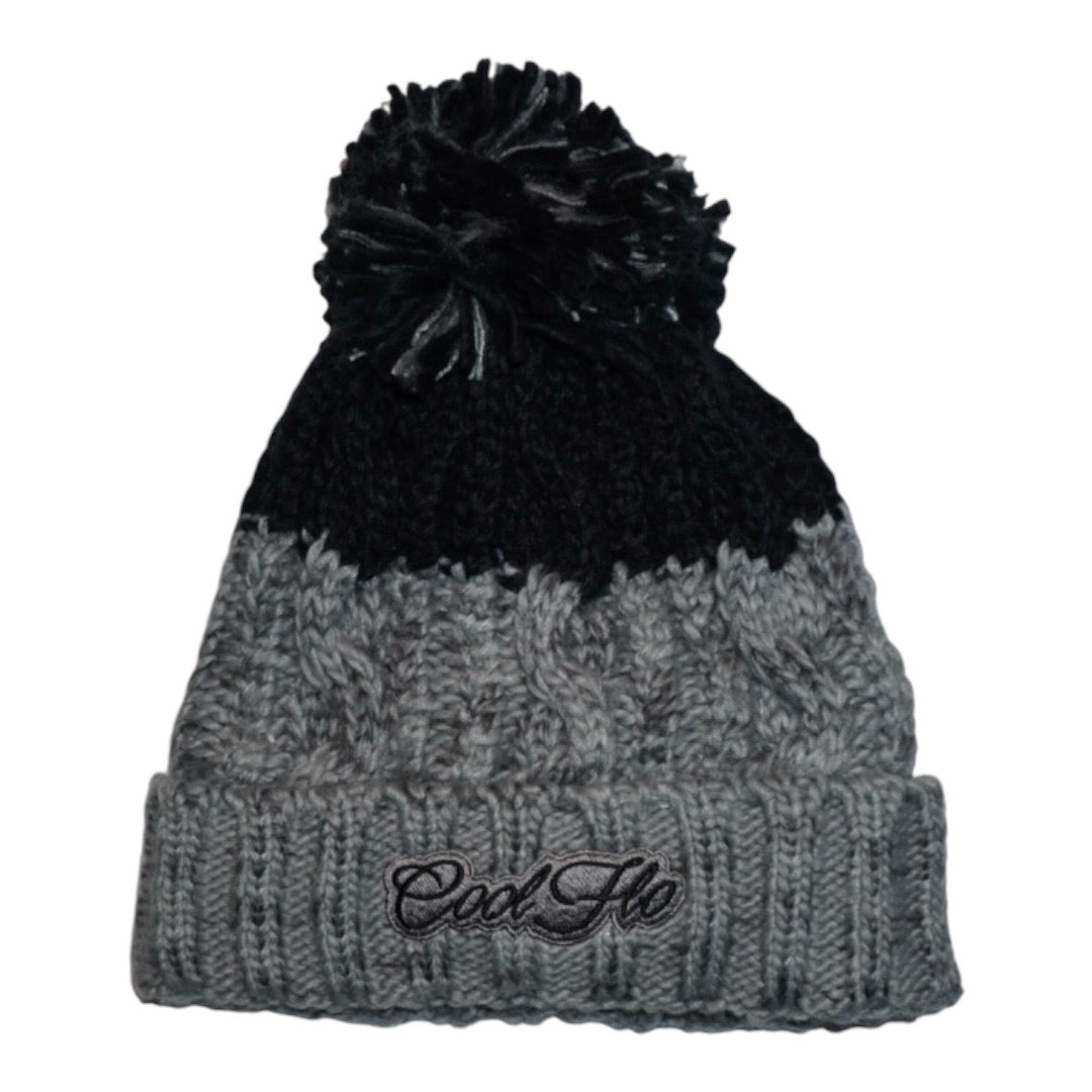 Chamonix chunky knit bobble hat with large pom pom and script logo.  Black and grey.