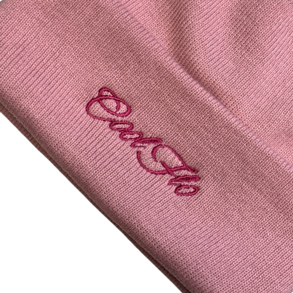 Close-up of Cool Flo Cuffed Beanie Hat in Dusky Pink with a darker pink Cool Flo embroidered logo on the cuff.