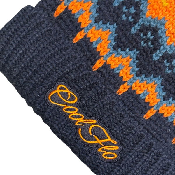 Close-up of Cool Flo Arctic Navy Ski Beanie in a navy and orange colour way with matching embroidered logo.