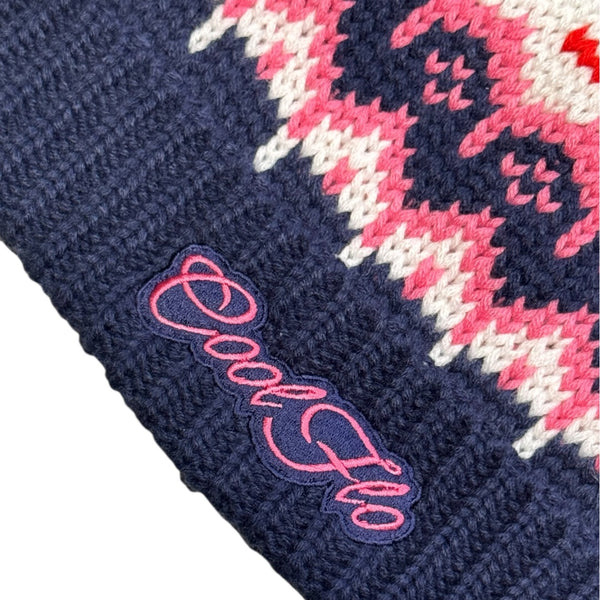 Close-up of Cool Flo Frost Bloom Ski Beanie in a navy, pink and white colour way with matching embroidered logo.