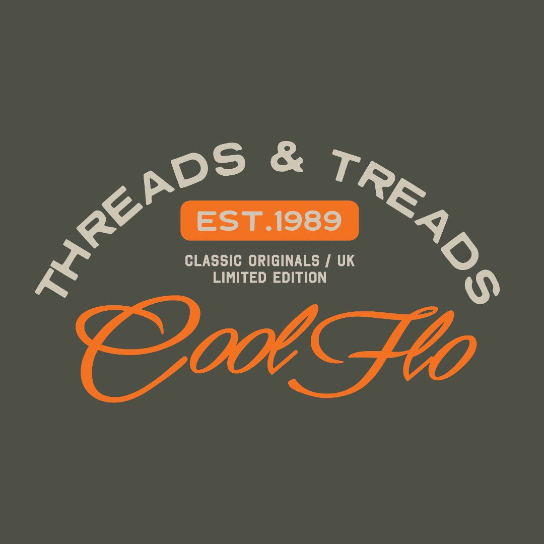 Close up of Threads & Treads print in orange and cream on a khaki t-shirt.