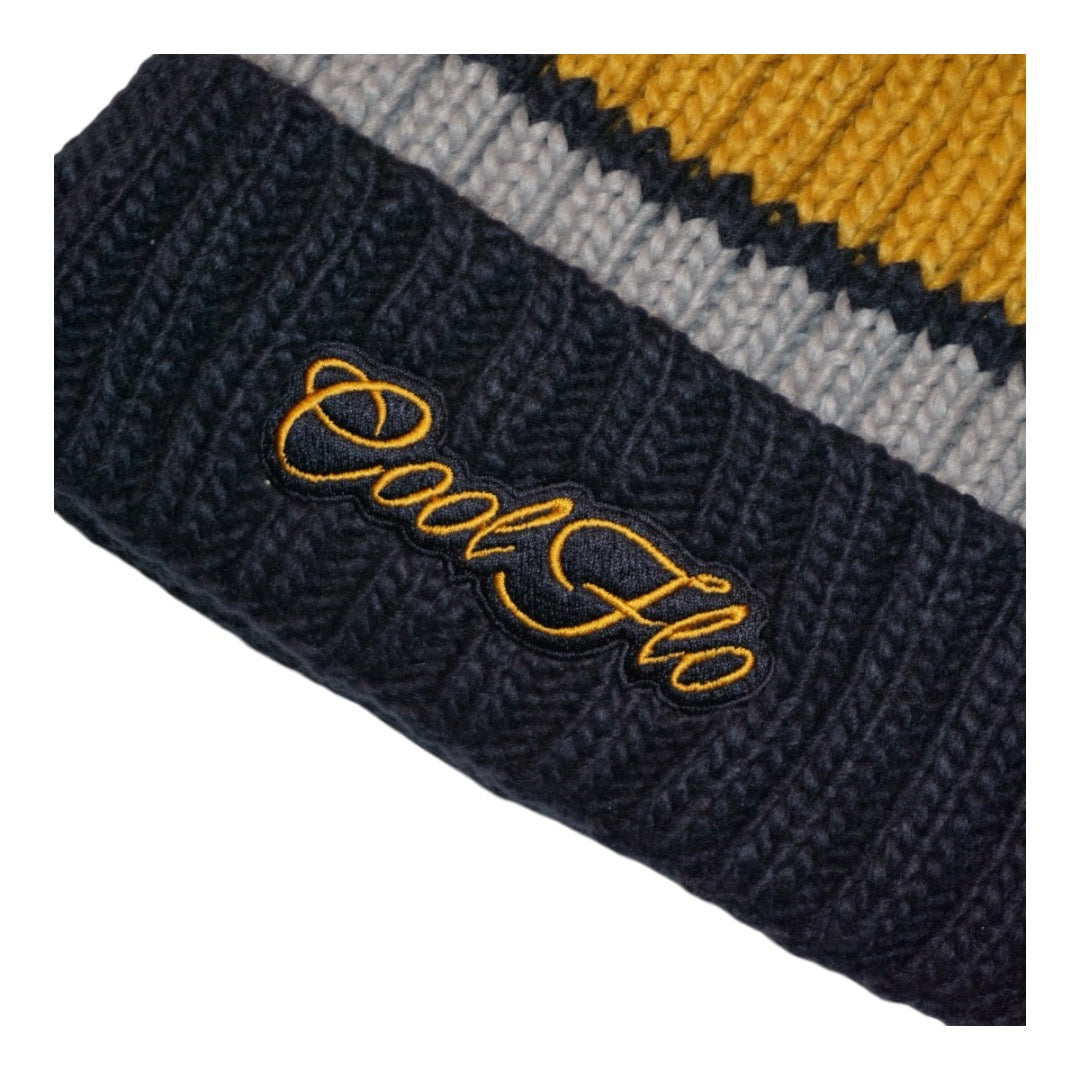 Chunky-knit bobble hat with script logo and large pom pom. Dark blue, grey and yellow.