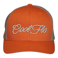 An orange trucker hat with khaki mesh back panels and 'Cool Flo' embroidered in yellow/gold script on the front, shown against a plain white background.