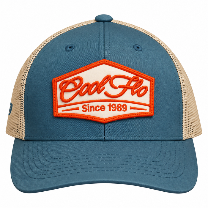 Front view of a Cool Flo Since 1989 trucker cap in Blue/Silver featuring an embroidered Since 1989 badge in Orange and White and a curved visor.