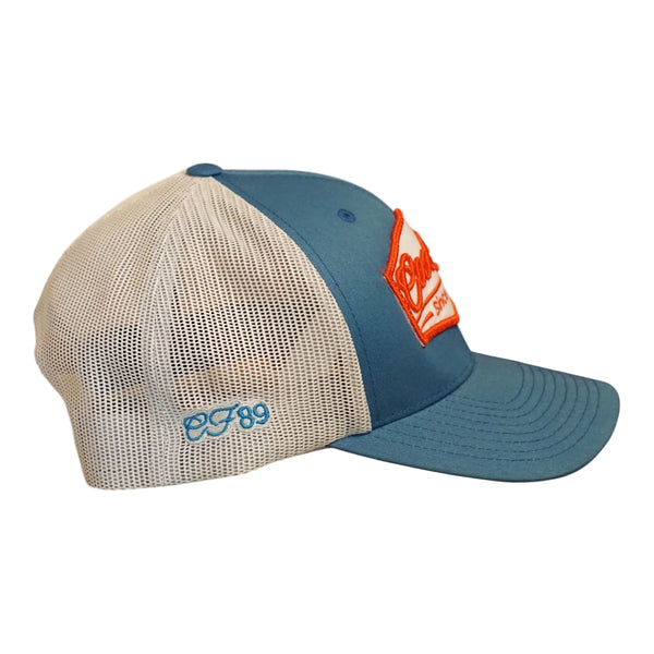 Right side view of a Cool Flo Blue/Silver Since 1989 trucker cap featuring Blue embroidered side detail, breathable mesh back panels and adjustable snapback fastening