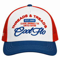 A red, white, and blue trucker hat with embroidered text reading 'THREADS & TREADS', 'EST. 1989', 'CLASSIC ORIGINALS / UK LIMITED EDITION', and 'Cool Flo'.
