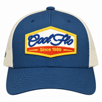 Front view of a Cool Flo Since 1989 trucker cap in Blue/White featuring an embroidered Cool Flo Since 1989 badge in Blue, Yellow and White and a curved visor.