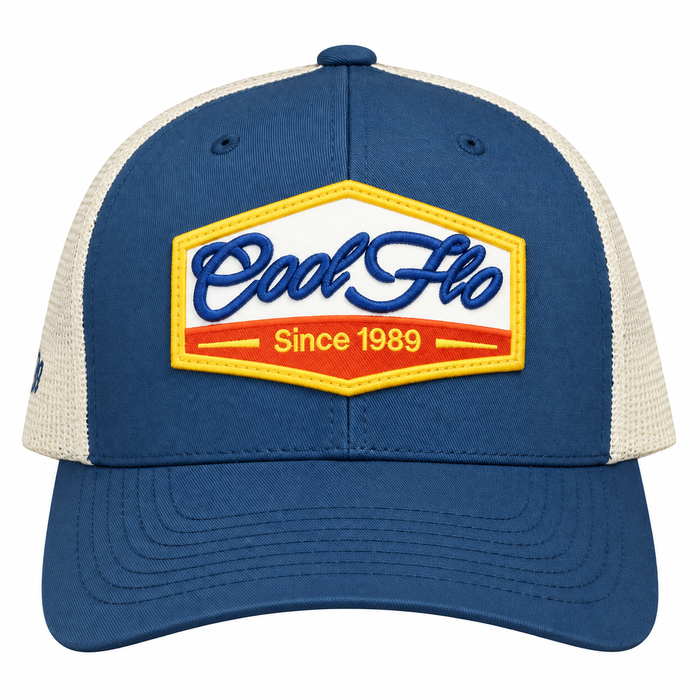 Front view of a Cool Flo Since 1989 trucker cap in Blue/White featuring an embroidered Cool Flo Since 1989 badge in Blue, Yellow and White and a curved visor.