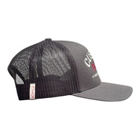 Cool Flo Custom Edition Dark Grey Trucker Cap with silver custom embroidery and burgundy logo, side view.