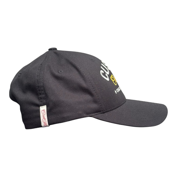 Cool Flo Custom Edition Black Baseball Cap with silver custom embroidery and yellow logo, side view.