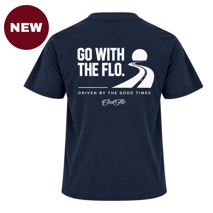 'NEW' Back view of Cool Flo navy blue t-shirt, featuring a white graphic print that reads 'GO WITH THE FLO.' A winding road and dipping sun illustration sits above the phrase 'DRIVEN BY THE GOOD TIMES' and a central 'Cool Flo' logo.