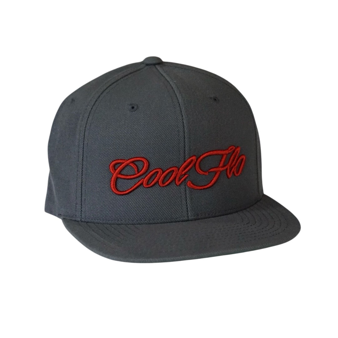 Dark grey snapback cap with red 3D embroidered Cool Flo script logo on the front.