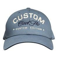 Cool Flo Custom Edition Delft Blue Baseball Cap with white custom embroidery and navy blue logo, front view.
